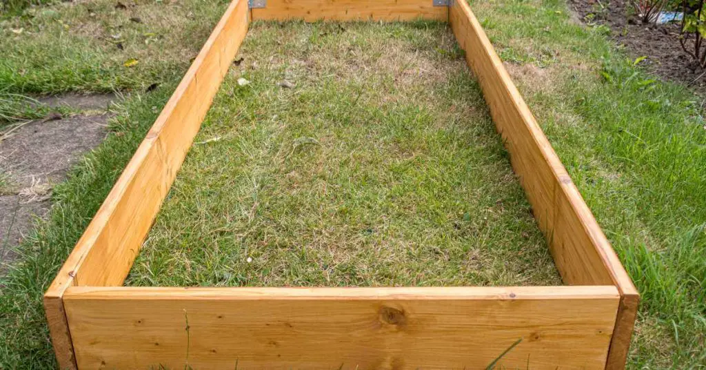 can you put a raised garden bed on grass